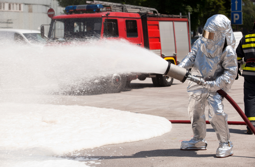 A firefighter in training with fire retardant foam. What effect does foam have on the environment? (iStock)