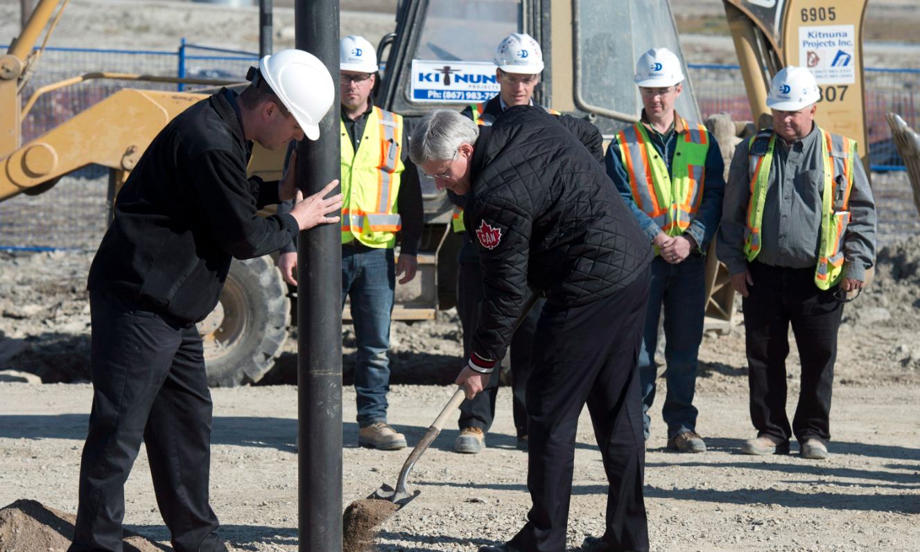 Canadian Prime Minister Stephen Harper shovels dirt during a ground breaking ceremony for the Canadian High Arctic Research Station on August 23, 2014 in Cambridge Bay, Nunavut.  The new Polar Knowledge Canada organization will be housed here when the station opens in 2017.(Adrian Wyld/The Canadian Press)