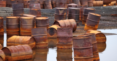 Rusty fuel and chemical drums on the Arctic coast. (iStock)