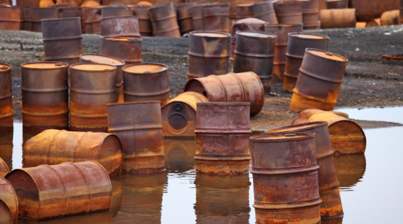 Rusty fuel and chemical drums on the Arctic coast. (iStock)