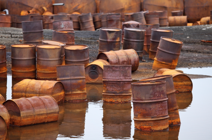 Rusty fuel and chemical drums on the Arctic coast. (iStock)