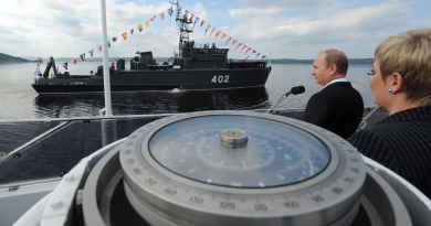 Russian President Vladimir Putin congratulates the crew of the Northern Fleet ship to mark the country's Navy Day in Severomorsk, Russia on Sunday, July 27, 2014. (Mikhail Klimentyev/Presidential Press Service/AP)