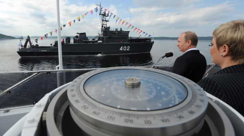 Russian President Vladimir Putin congratulates the crew of the Northern Fleet ship to mark the country's Navy Day in Severomorsk, Russia on Sunday, July 27, 2014. (Mikhail Klimentyev/Presidential Press Service/AP)