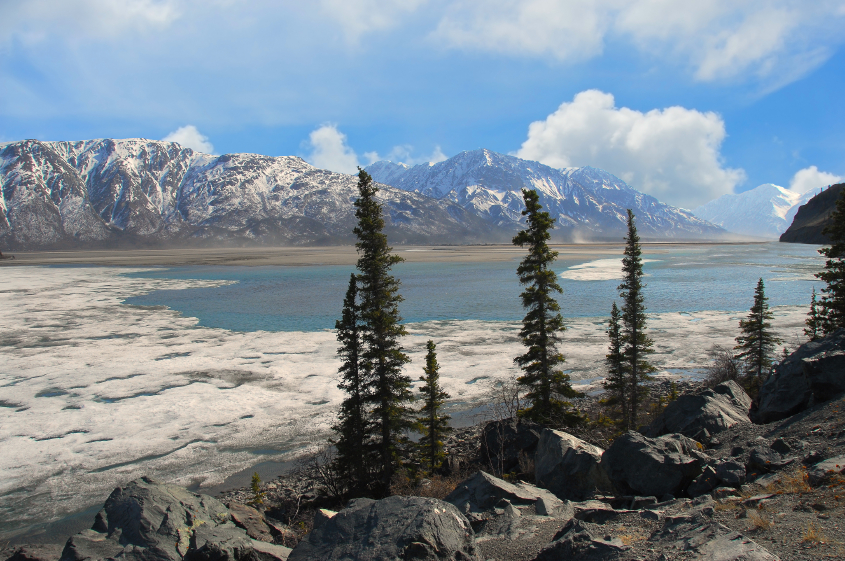 Frozen lake thawing in the Spring in Alaska's Wrangell Mountains. (iStock)