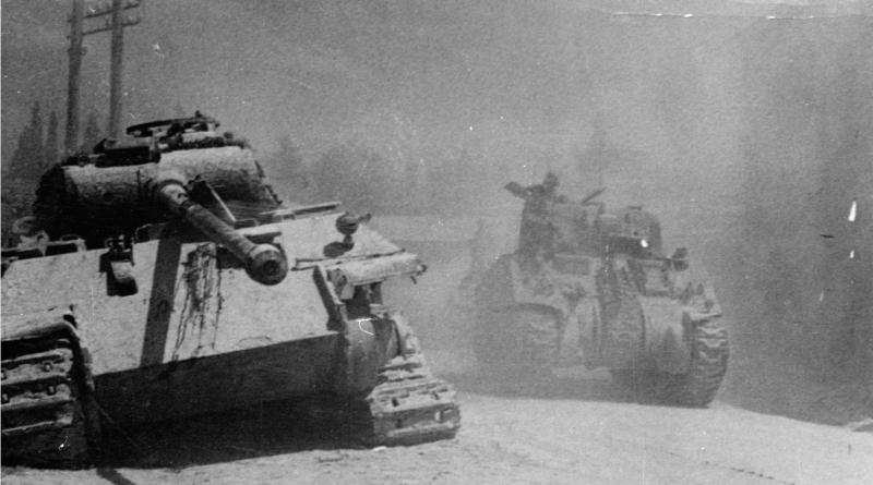 An allied Sherman Tank passing a knocked out German Panther tank during the advance on Arezzo, Italy in July 1944. Sherman tanks are among the relics Russia's Northern Fleet are raising from a sunken WW2 American ship. (Keystone/Getty Images)