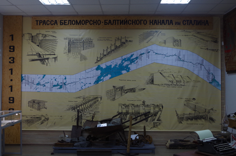 The museum’s map of the White Sea-Baltic Canal (named after Stalin), with tools used by the prisoners to dig out the canal. (Mia Bennett)