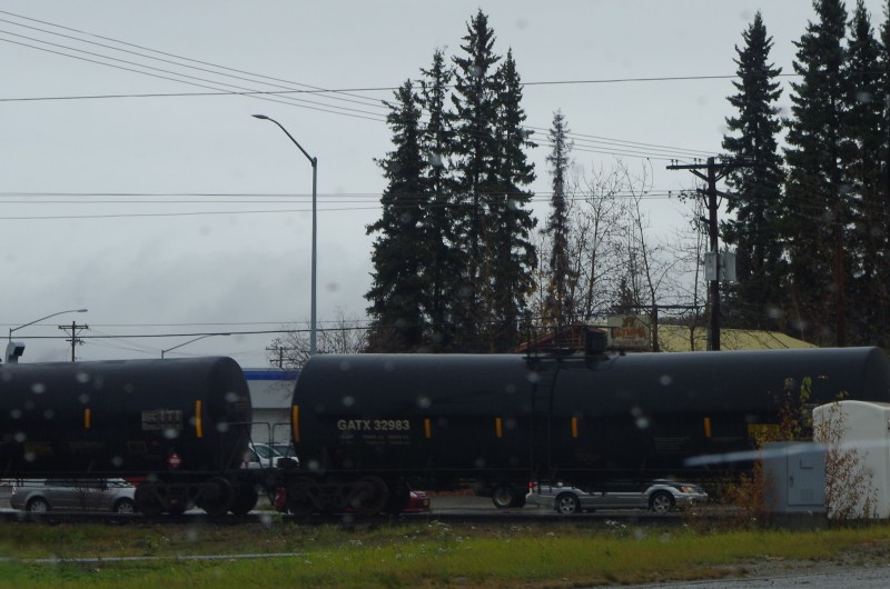 Through the windshield, an oil tanker train rumbles through Fairbanks. (Mia Bennett)
