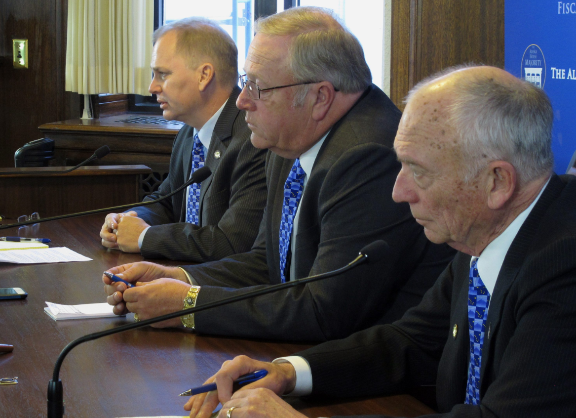 Members of the Alaska House majority speak to members of the media on the first day of the Legislature's third special session this year on Saturday, Oct. 24, 2015, in Juneau, Alaska. The focus of the special session is on the proposed buy out of TransCanada Corp. from the gas project the state is pursuing. Pictured from the top are Reps. Mark Neuman, Mike Chenault and Steve Thompson. Neuman and Thompson are co-chairs of the House Finance Committee; Chenault is the House speaker. (Becky Bohrer/AP)