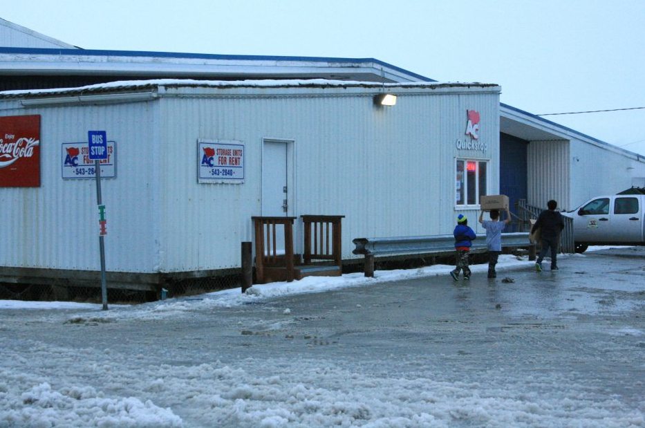 The state Alcoholic Beverage Control Board on Thursday approved a liquor store at this AC Quickstop, where the storage units now are housed. Alaska Commercial Co. will need two to four months or longer to ready the space for a store, an executive said Thursday. (Lisa Demer/Alaska Dispatch News)