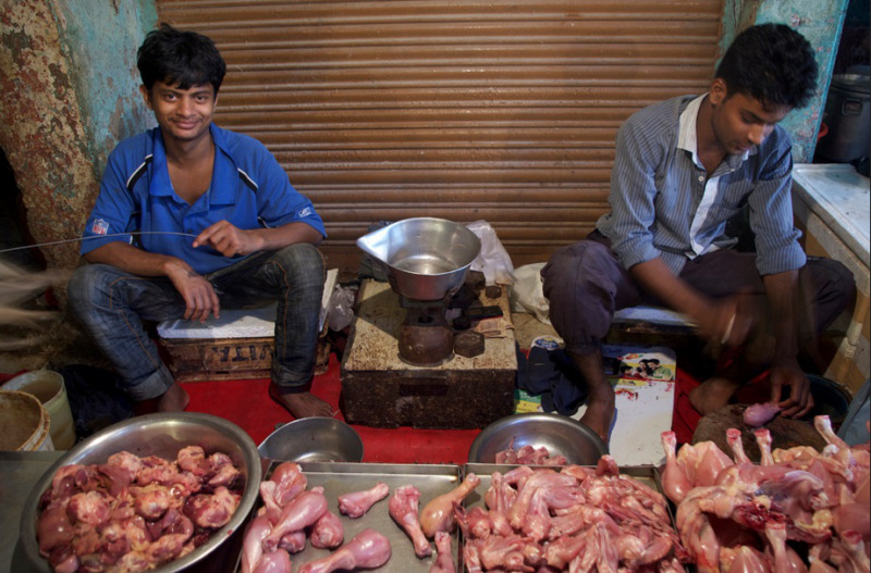 Chicken for sale at a market in New Delhi, India. Emissions from cooking and heating in Asia are the largest contributor by volume to Arctic warming. September 2013. (Mia Bennett)