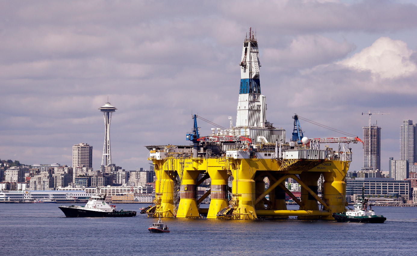 The oil drilling rig Polar Pioneer in a dock in Seattle in May 2015. The rig was one of two drilling rigs Royal Dutch Shell had planned to use for Arctic oil exploration. (Elaine Thompson/File/AP)
