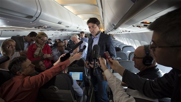 Canada's Prime Minister Justin Trudeau speaks to reporters while flying from Antalya, Turkey to Manila, Philippines on Tuesday, Nov. 17, 2015, to attend the APEC Summit. (Sean Kilpatrick/The Canadian Press)