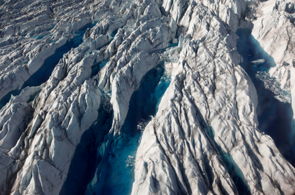 Pools of melted ice form atop Jakobshavn Glacier, near the edge of the Greenland ice sheet in 2011. (Brennan Linsley/AP)
