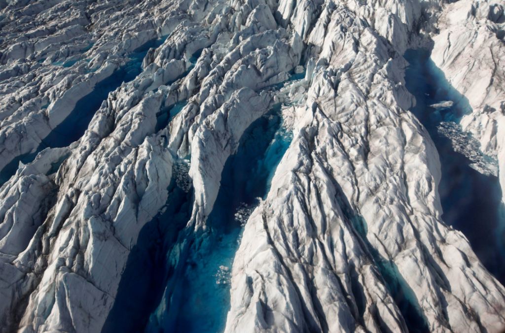 Pools of melted ice form atop Jakobshavn Glacier, near the edge of the Greenland ice sheet in 2011. A story looking at the implications of Greenland's ice melt for the world's oceans was among you top stories this week. (Brennan Linsley/AP)