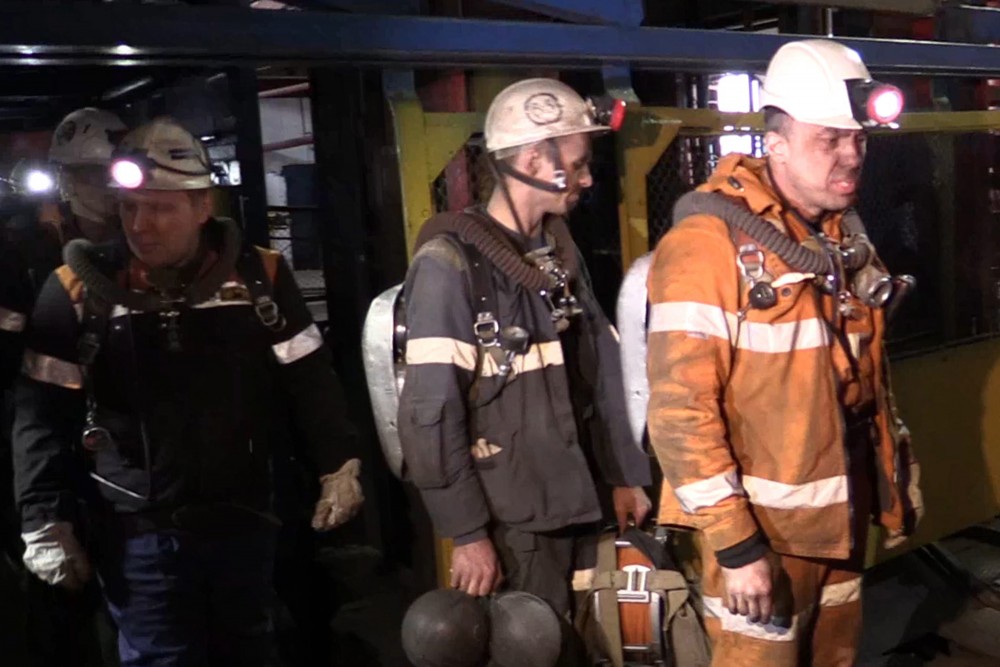 Photo provided by Russian Emergency Situations Ministry press service on Sunday, Feb. 28, 2016 shows rescuers leaving an elevator in Vorkuta, Russia. (AP Photo/Ministry of Emergency Situations press service via AP)