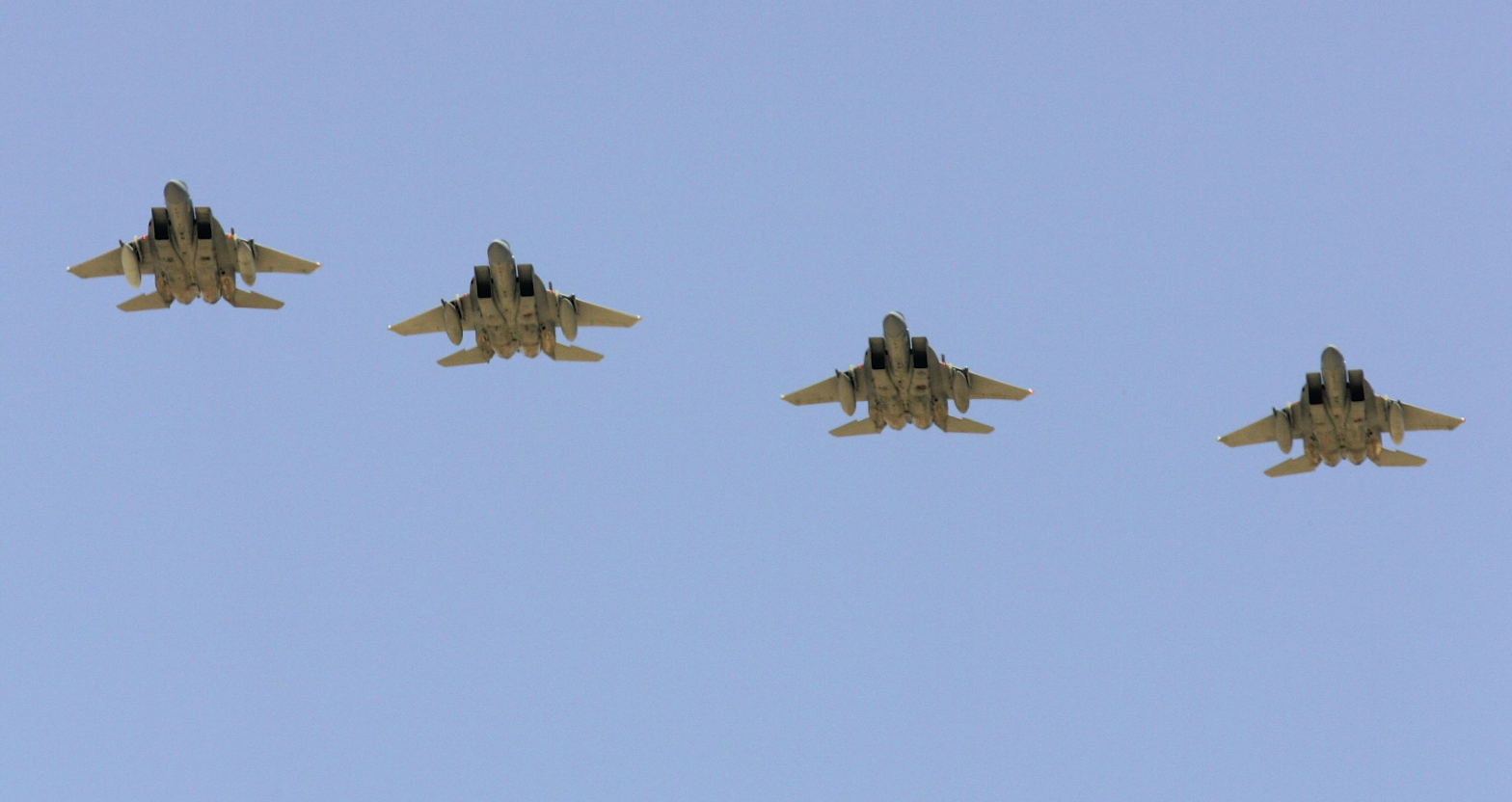 Four U.S. Air Force F-15 aircraft fly over Nellis Air Force Base in Las Vegas, Nevada in 2006. (Ethan Miller/Getty Images)