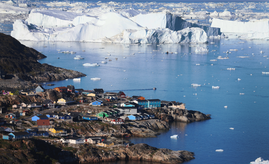 The village of Ilulissat is seen near the icebergs that broke off from the Jakobshavn Glacier on July 24, 2013 in Ilulissat, Greenland. (Joe Raedle/Getty Images)