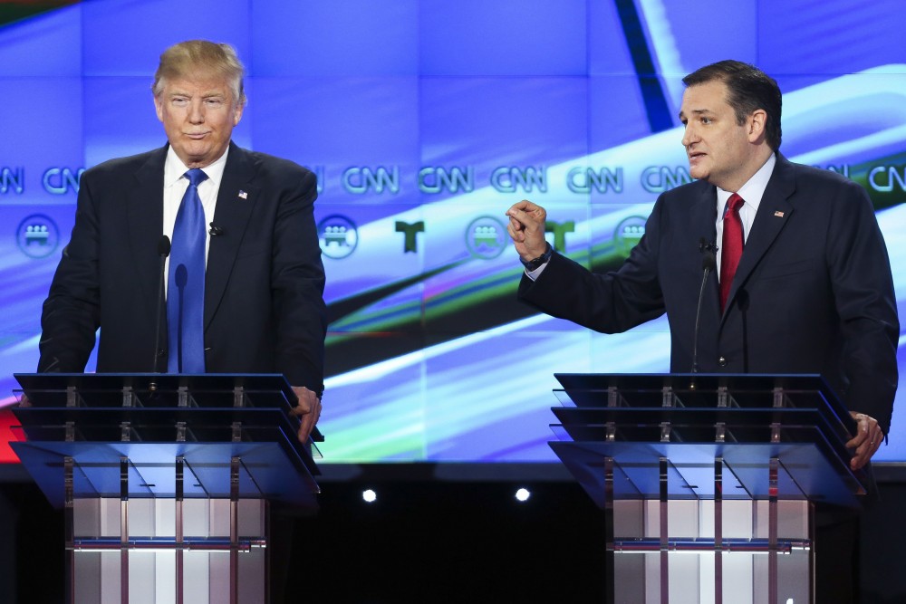 Republican presidential candidate, Donald Trump, left, listens as Republican presidential candidate, Sen. Ted Cruz, R-Texas, answers a question during the Republican Presidential Primary Debate at the University of Houston Thursday, Feb. 25, 2016, in Houston. (Gary Coronado/AP Photo/Houston Chronicle, Pool) 