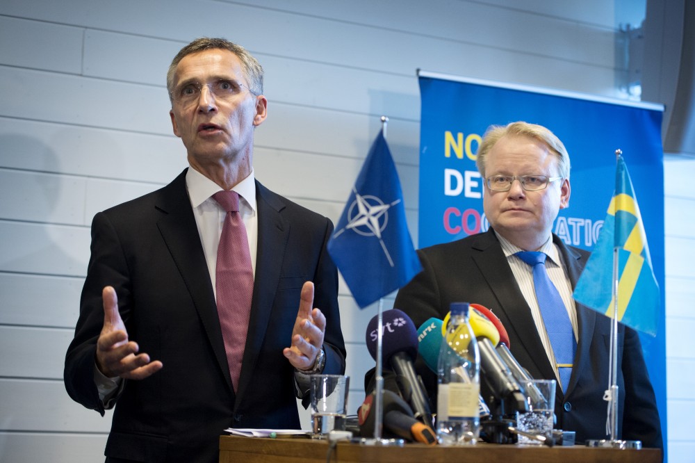 NATO Secretary General Jens Stoltenberg (L) and Sweden's Defence Minister Peter Hultqvist hold a news conference after a Nordic defence ministers meeting in Stockholm, Sweden, November 10, 2015. Jessica Gow/REUTERS/TT News Agency