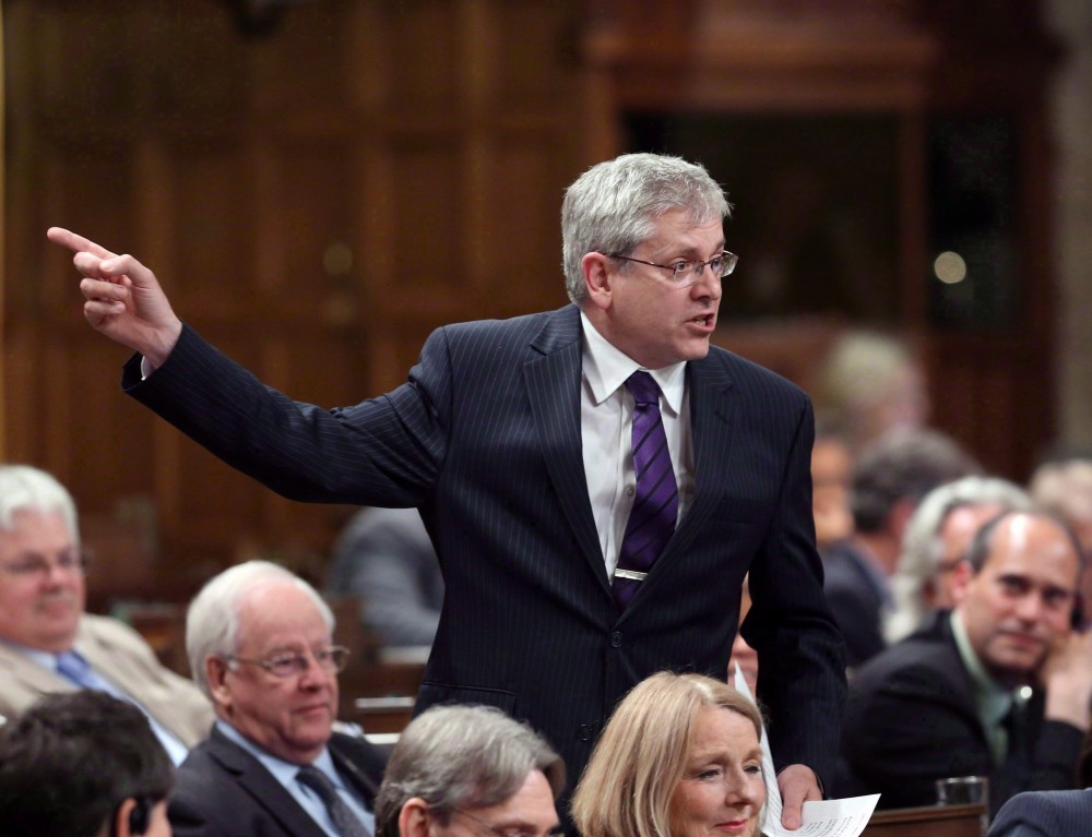 NDP MP Charlie Angus stands in the House of Commons during question period on Parliament Hill in Ottawa on June 9, 2015. The Speaker of the House of Commons has agreed to hold an emergency debate on the suicide crisis in Attawapiskat First Nation. Fred Chartrand/THE CANADIAN PRESS 