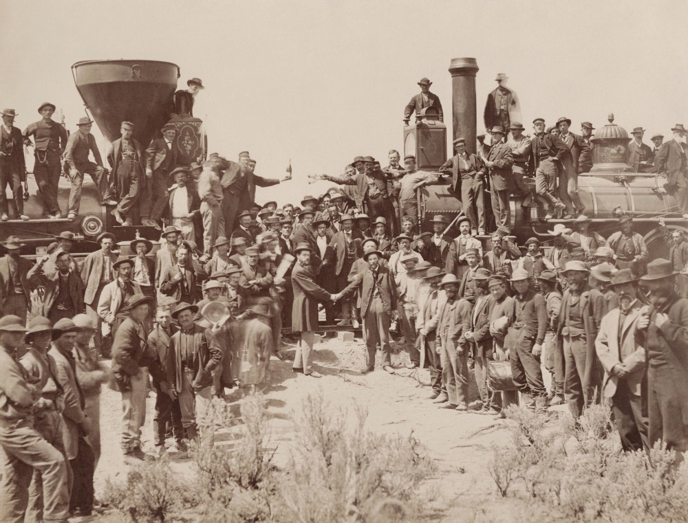 A.J. Russell image of the celebration following the driving of the "Last Spike" at Promontory Summit, U.T., May 10, 1869. By Andrew J. Russell - Yale University Libraries, Public Domain, https://commons.wikimedia.org/w/index.php?curid=41243910