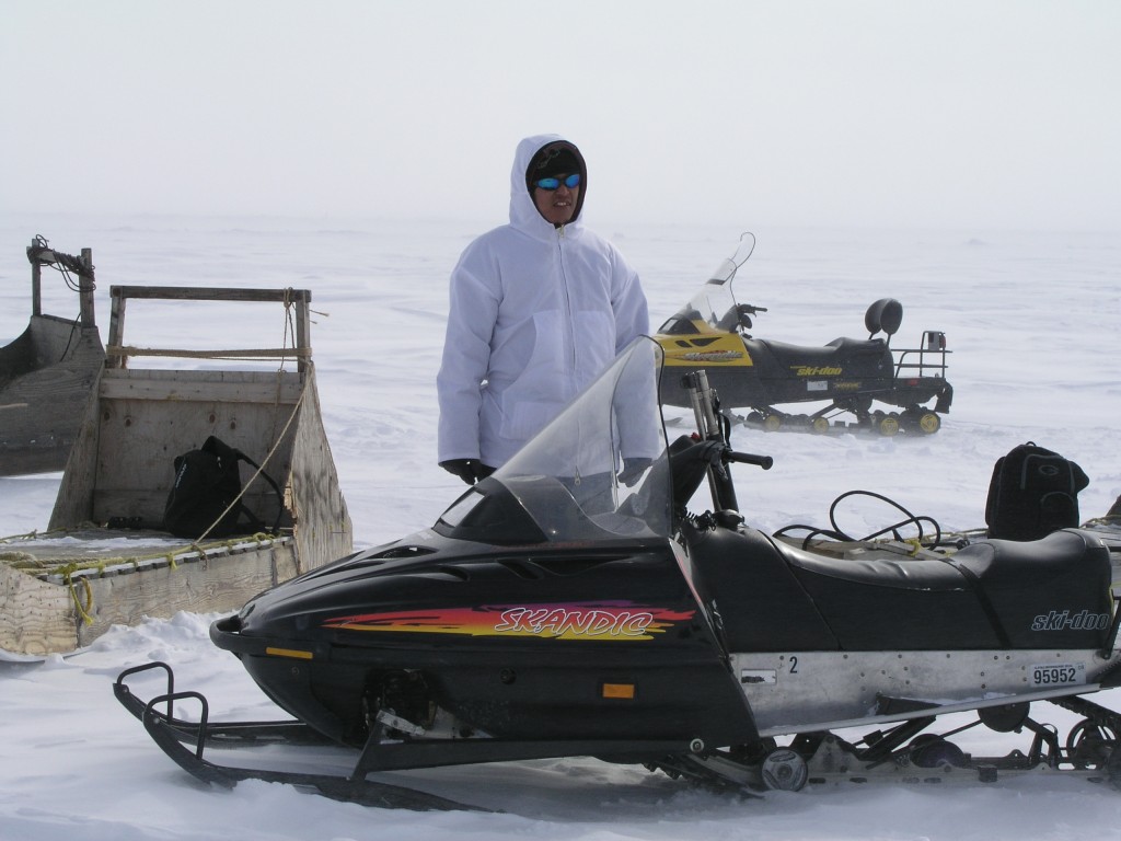 Remote Arctic communities rely on close cooperation. (First Nation guide standing bear guard for scientists). Photo Irene Quaile