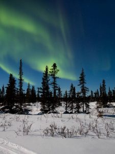 Northern lights over Tsá Tué, courtesy of UNESCO