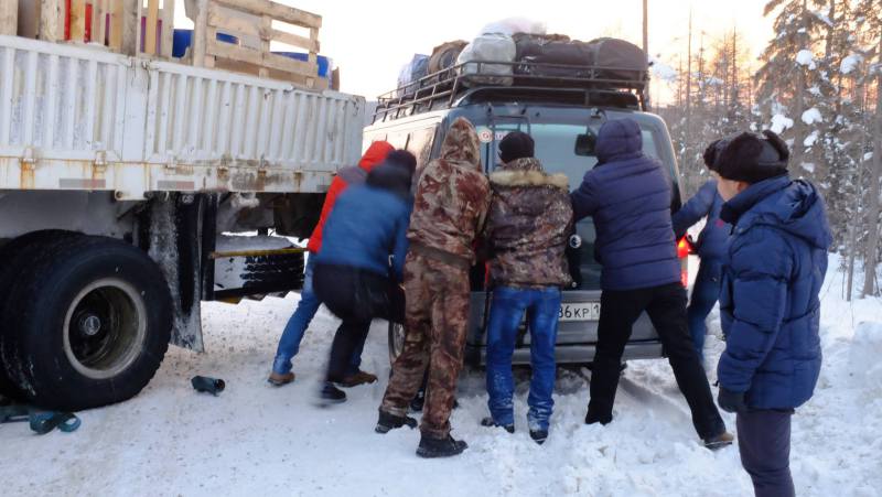 Success in pushing our van around the stuck truck. Photo by Mia Bennett