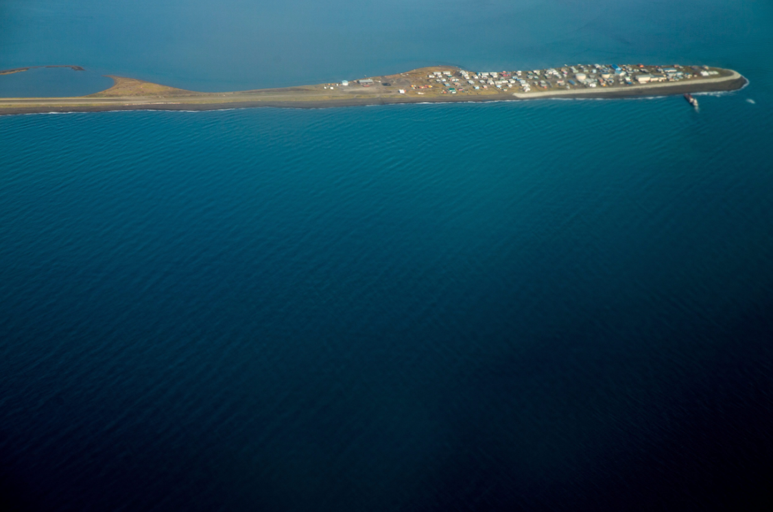 This aerial photo shows the island village of Kivalina, Alaska. What is the future of solar energy in communities like this one? (Andrew Harnik/AP/The Canadian Press)