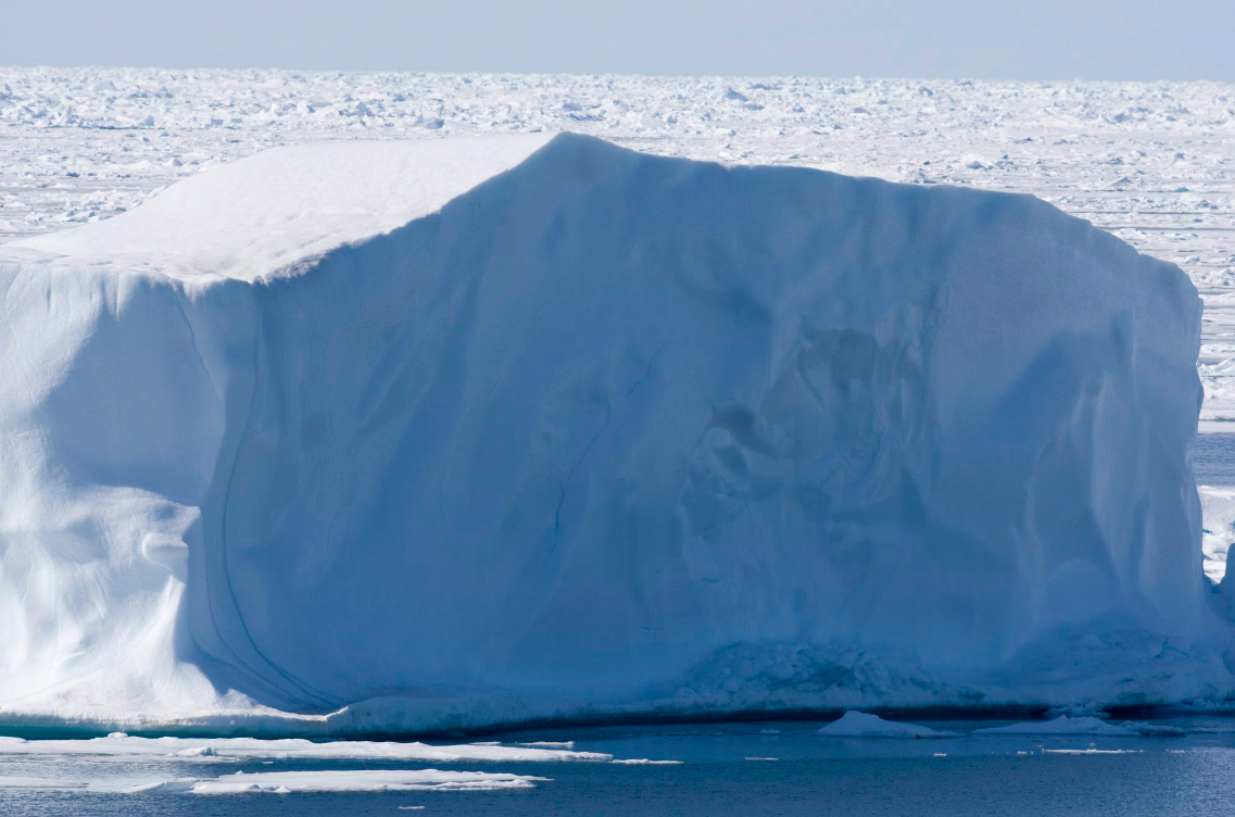 An iceberg floating in Canada's High Arctic. As climate change makes northern shipping routes more accessible, what impact will it have on Canada's trade relationships with Asia? (Jonathan Hayward/The Canadian Press)