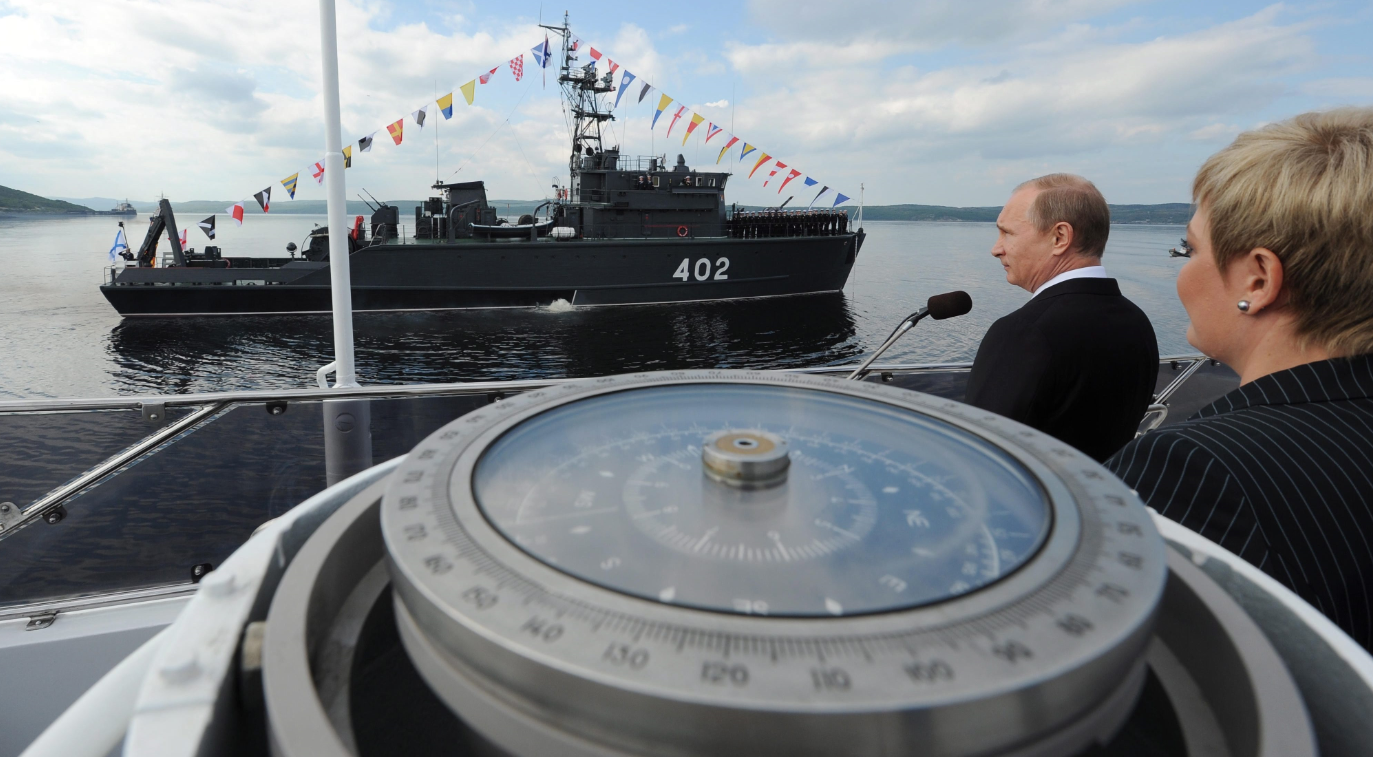 Russian President Vladimir Putin congratulates the crew of the Northern Fleet ship to mark the country's Navy Day in Severomorsk, Russia on Sunday, July 27, 2014. Paratrooper exercises took place over the North Pole this season. (Mikhail Klimentyev/Presidential Press Service/The Associated Press/The Canadian Press)