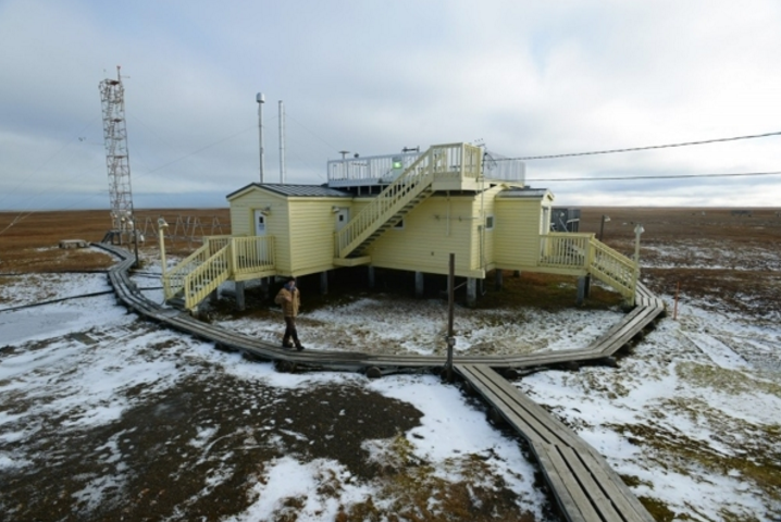 Technician Ross Burgener staffs the NOAA Global Monitoring Division Barrow Observatory on September 21, 2015, about 5 miles outside of town. Three vertical intakes behind the structure, back left, capture air samples for analysis. The site also hosts short-term research projects from around the world. (Erik Hill / Alaska Dispatch News)