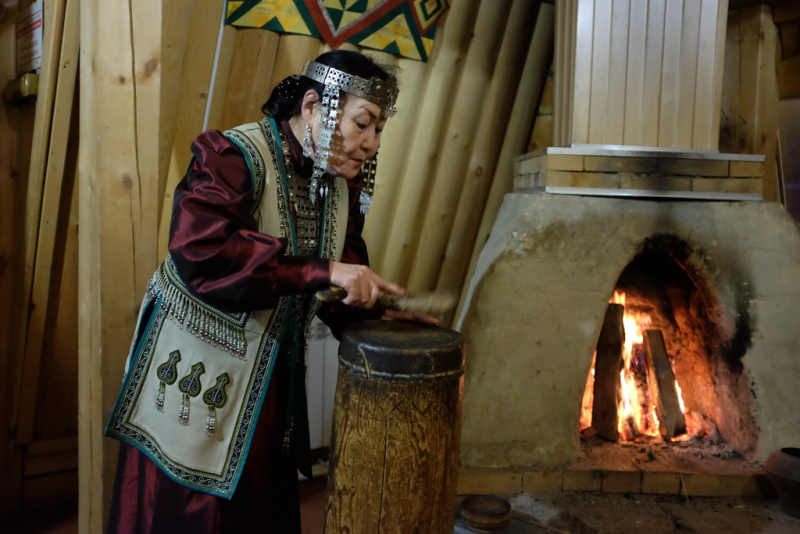 Yakut woman (Yakutka) demonstrating a traditional ceremony at a national restaurant outside Yakutsk.