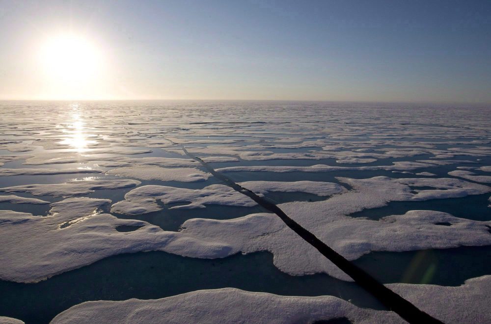 The midnight sun shines over the ice covered waters near Resolute Bay as seen from the Canadian Coast Guard icebreaker Louis S. St-Laurent, Saturday, July 12, 2008. (Jonathan Hayward/THE CANADIAN PRESS)