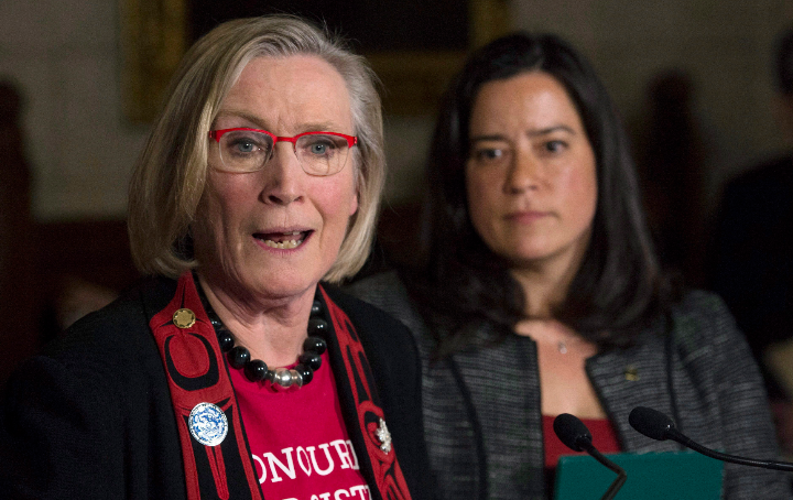 Canada's Minister of Justice and Attorney General of Canada Jody Wilson-Raybould looks on as Minister of Indigenous and Northern Affairs Carolyn Bennett responds to a question in December 2015 during an announcement about the Missing and Murdered Indigenous Women inquiry. (Adrian Wyld/The Canadian Press)