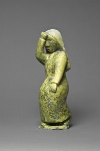 Oviloo Tunnillie - Grieving Woman, 1997. stone, 35 x 12.5 x 11.3 cm. Collection of the Winnipeg Art Gallery, (Photo: Ernest Mayer)