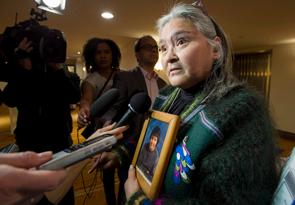 Elisapee Sheutiapik, former mayor of the Arctic Canadian city of Iqaluit holds a photo of Mary Ann Birmingham, who was 15 when she was murdered in Iqaluit in 1986. Sheutiapik was at the National Roundtable on Missing and Murdered Indigenous Women and Girls in Ottawa on Friday, Feb. 27, 2015. (Justin Tang/The Canadian Press)