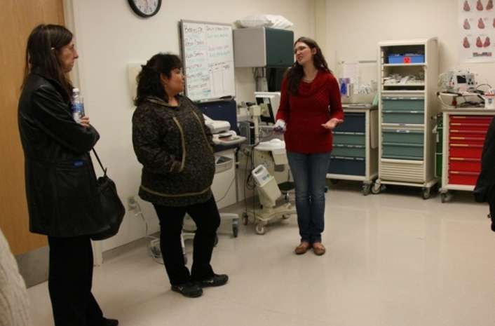 Mary Smith, principal deputy director of the U.S. Indian Health Service, and Gail Alstrom-Beans, longtime operations manager of the St. Marys health clinic, listen on Thursday, Aug. 11, 2016, to Jennifer Spillar, operations manager of the Hooper Bay health clinic. Managers with the Yukon-Kuskokwim Health Corp. led a tour of facilities in Hooper Bay and Chevak to show federal officials the challenges of Bush health care. (Lisa Demer / Alaska Dispatch News)