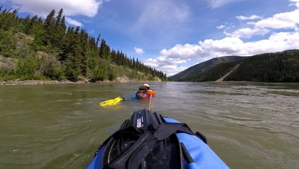 Denis Morin swam, with a riverboard, from Whitehorse, Yukon, to Emmonak, Alaska, between May 25 and Aug. 9 2016. This image is made from a GoPro mounted to his cargo. As Morin swam the upper reaches of the Yukon River, he towed his camp, food and other supplies. (Denis Morin)