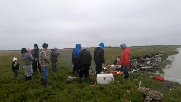 He shared a meal with a group from Emmonak on the shore of the Bering Sea. (Denis Morin)