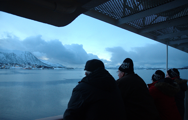 Beanie-wearing German tourists on board a Hurtigruten vessel off northern Norway. (Mia Bennett)