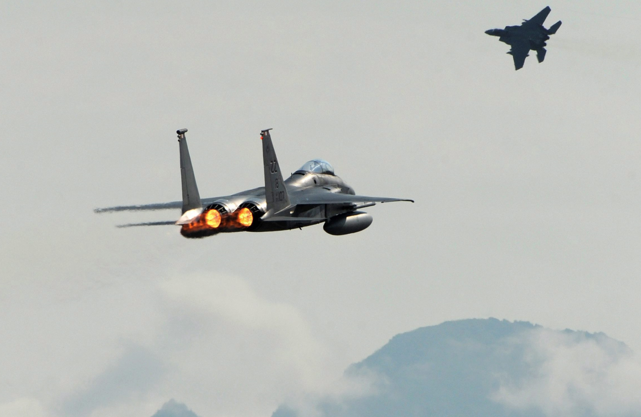 A pair of F-15C Eagles take off from Joint Base Elmendorf-Richardson near Anchorage, Alaska, Tuesday, June 23, 2015, while participating in Northern Edge, a joint training exercise. (Bill Roth/Alaska Dispatch News/AP)