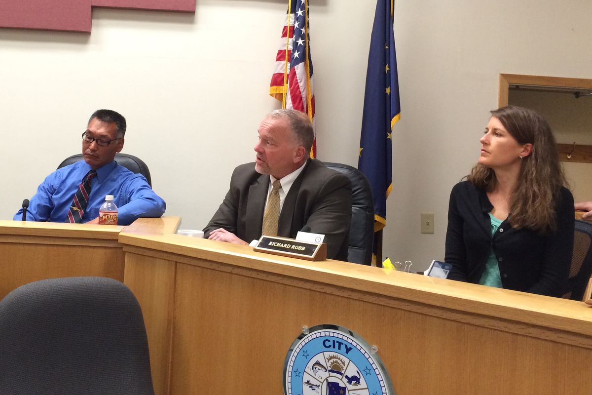 Jerry Evan, an investigator with Alaska State Troopers; Marlin Ritzman, FBI special agent in charge; and Andrea Hattan, assistant U.S. Attorney, listen to residents Monday at a community meeting on heroin in Bethel. (Lisa Demer / Alaska Dispatch News)