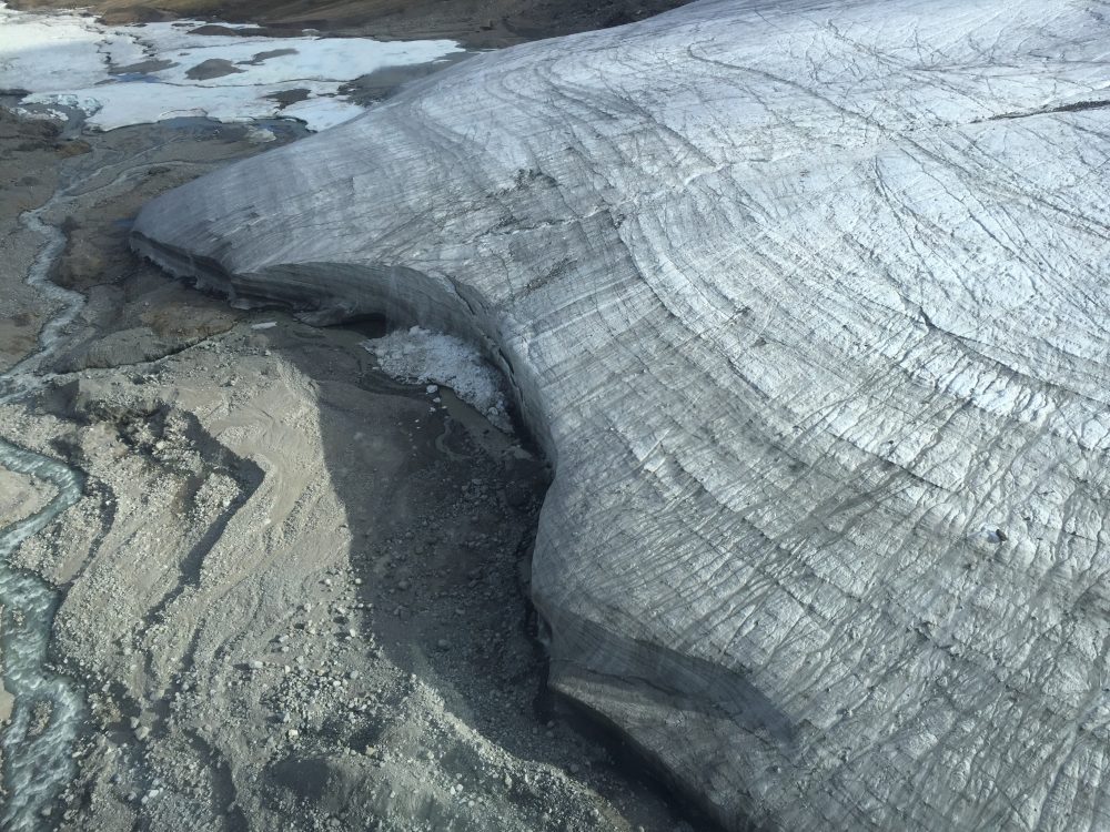 The process of dry calving is seen here in the broken off ice chunks at the base of this glacier. University of Calgary geographer Brian Moorman is working with the Canadian Space Agency to study the effects of dry calving on rising sea levels. (Brian Moorman / University of Calgary)
