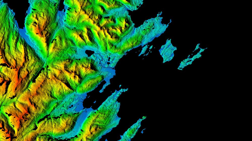 This Arctic digital elevation model image centers on Kodiak Benny Benson State Airport, a public and military airport located five miles southwest of the city of Kodiak. The image highlights the rugged relief surrounding the three runways of the airport and clearly depicts vegetation, buildings, coastal features and the drainage network of the area. (NGA)