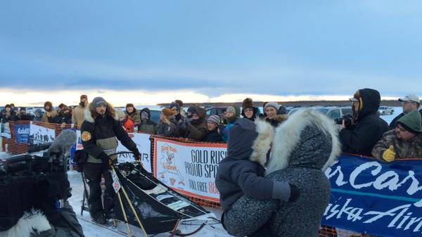 Pete Kaiser drives his dog team into the finish chute en route to winning his second straight Kuskokwim 300 in Bethel, Alaska on Sunday, Jan. 17, 2016. (Alaska Dispatch News / Lisa Demer)