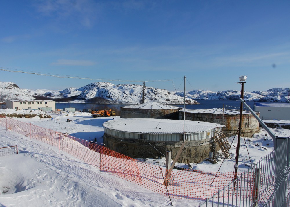 The three storage tanks with spent nuclear fuel equivalent to some 100 submarine reactors. (Aleksandr Emelianenko / The Independent Barents Observer)