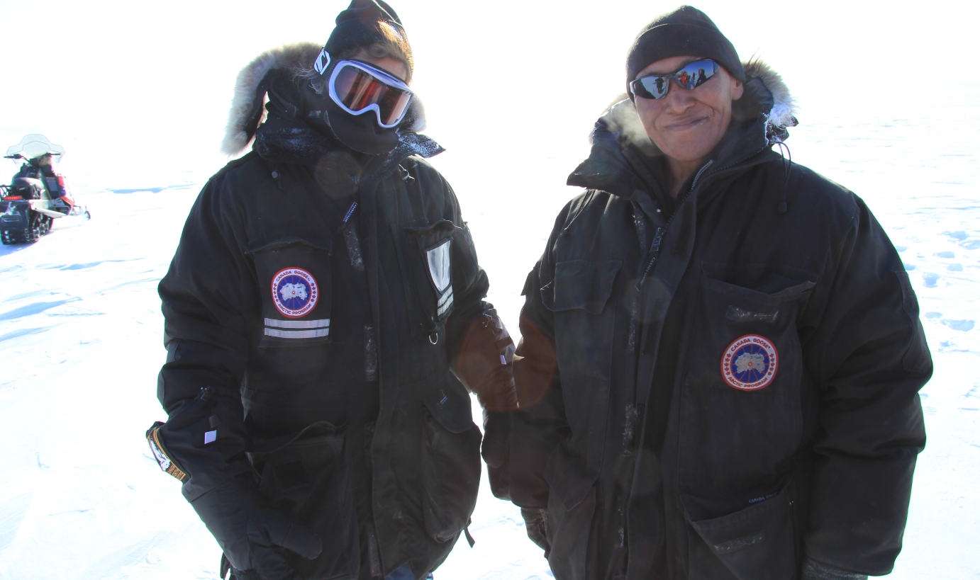 University of Calgary professor Susan Kutz (left) and Cambridge Bay hunter Colin Amegainek out on the land in Cambridge Bay, Nunavut. (Eilís Quinn/Eye on the Arctic)