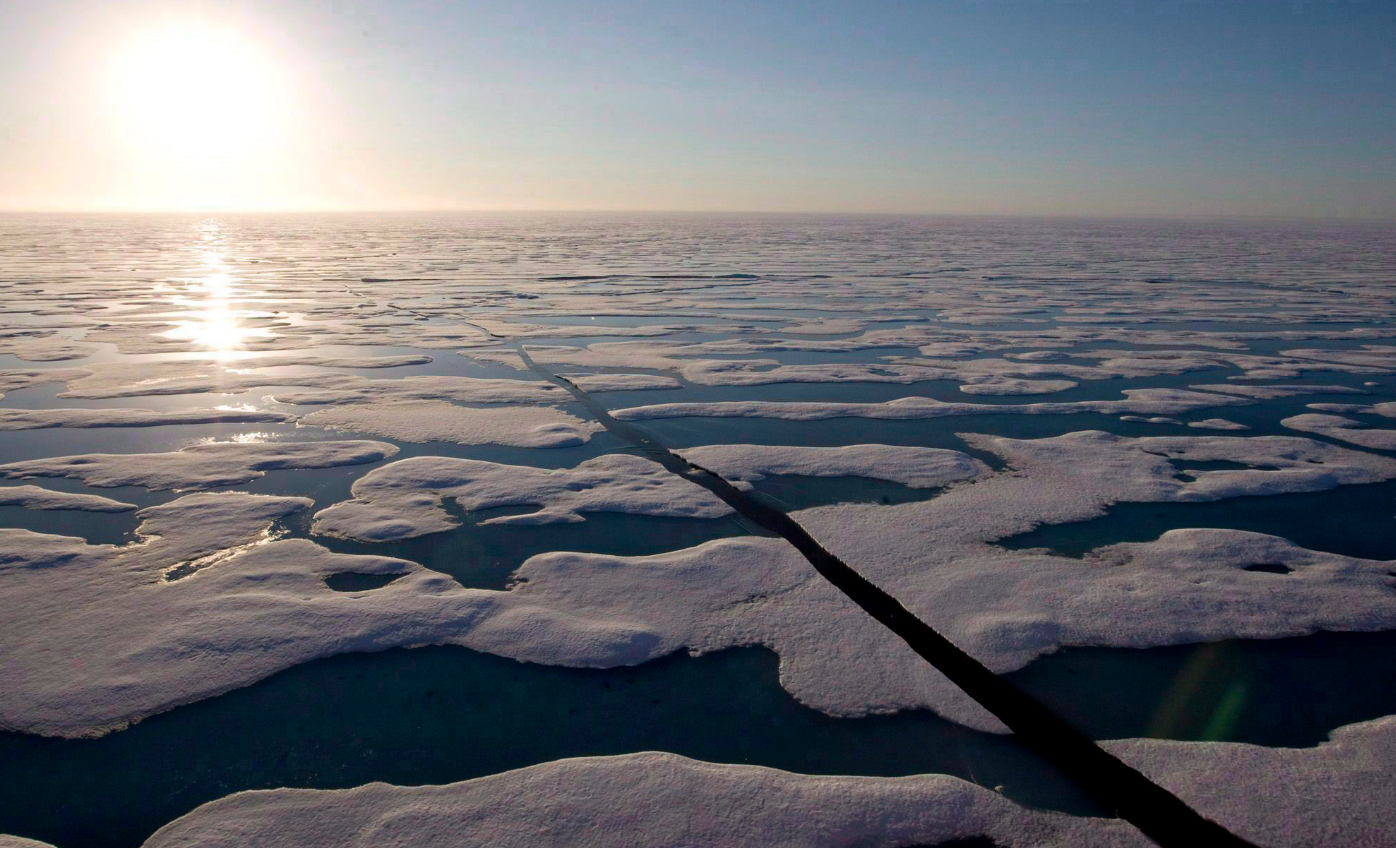 The midnight sun shines over the ice covered waters near Resolute Bay Canada in 2008. (Jonathan Hayward/The Canadian Press)