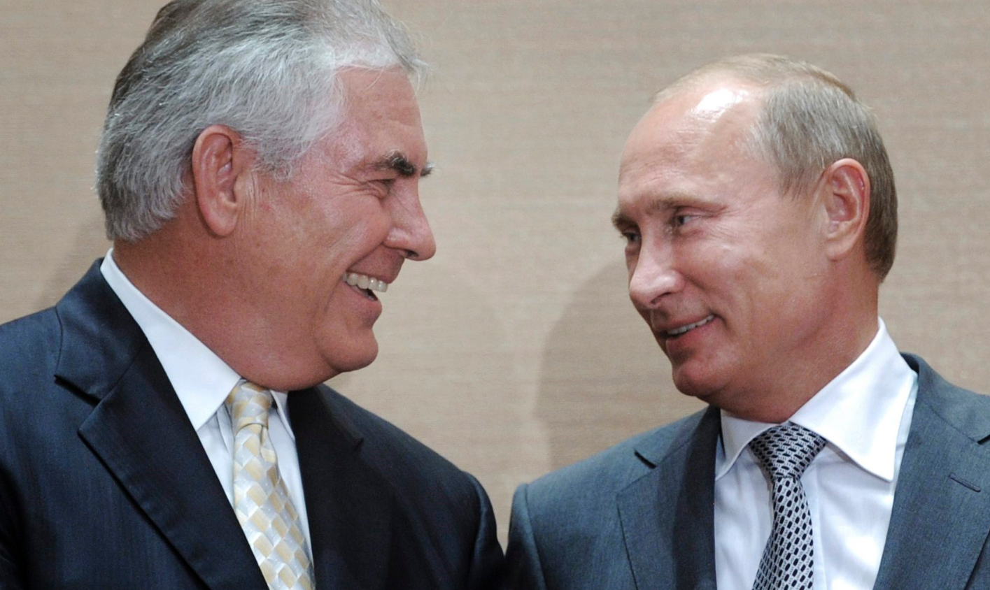 Russian Prime Minister Vladimir Putin, right, and Rex Tillerson, ExxonMobil's chief executive smile during a signing ceremony in the Black Sea resort of Sochi, Russia in this Aug. 30, 2011, file photo. President-elect Donald Trump selected ExxonMobil CEO Rex Tillerson to lead the State Department on Monday, Dec. 12, 2016. (Alexei Druzhinin/RIA Novosti via AP, Pool)